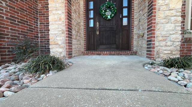 Lifting and Stabilizing concrete porch in Rogers, AR.
